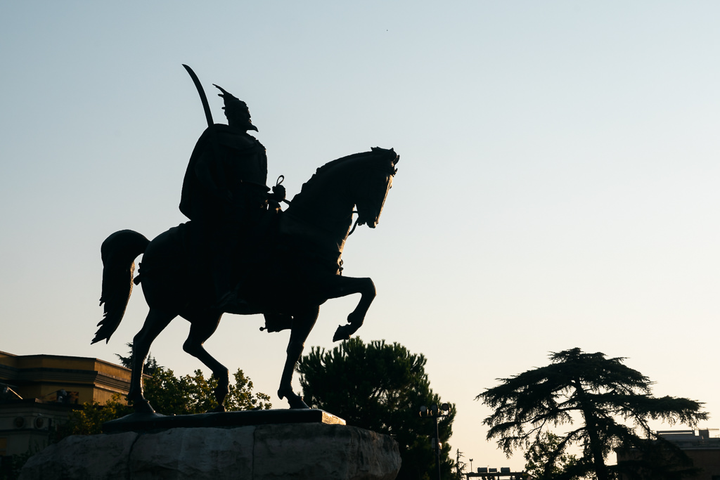 A statue of a man riding a horse in Albania