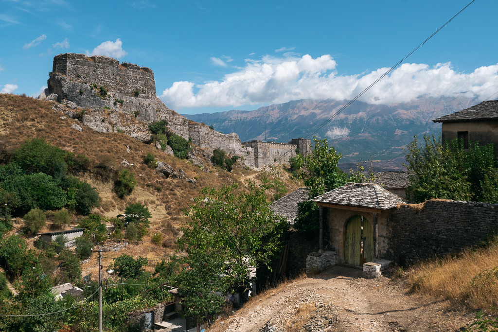 Aerial view of Gjirokastër Castle above the gray-stone town