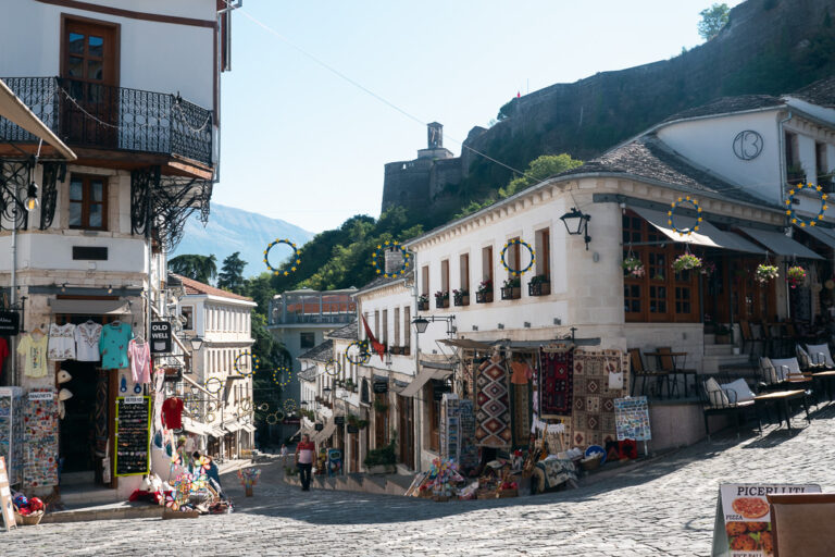 Streets of Gjirokaster, Albania Old Town with stores.