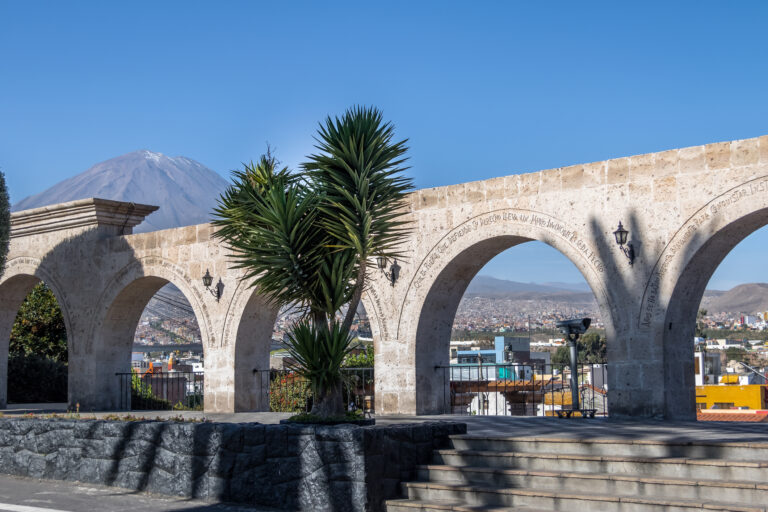 Stone arches at the Mirador de Yanahuara overlooking Misti volcano in the background