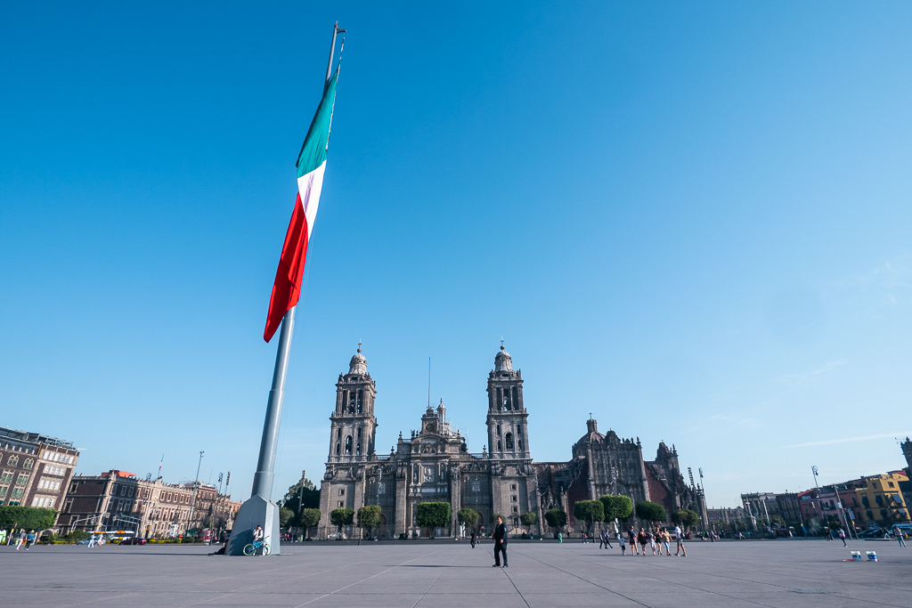 A view of a church and Mexican flag at the Zocalo in Mexico City