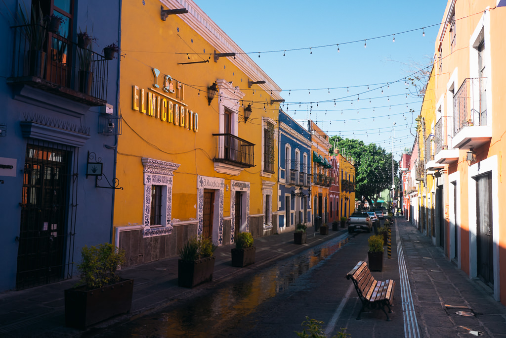 A street in Puebla with many colorful buildings