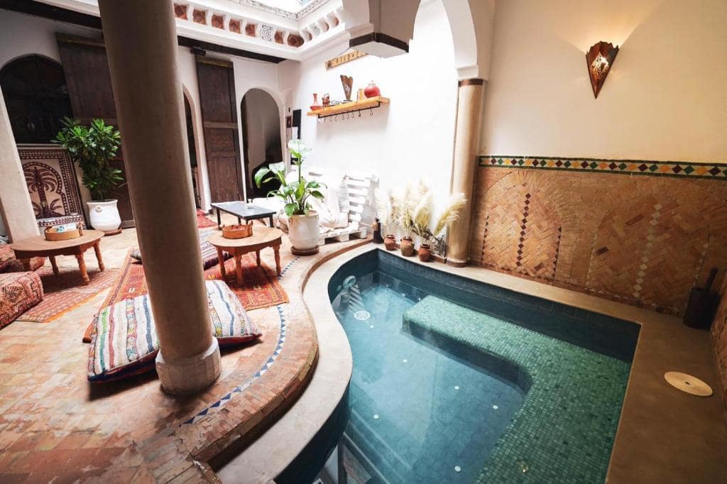 A corner swimming pool in a riad in Marrakech