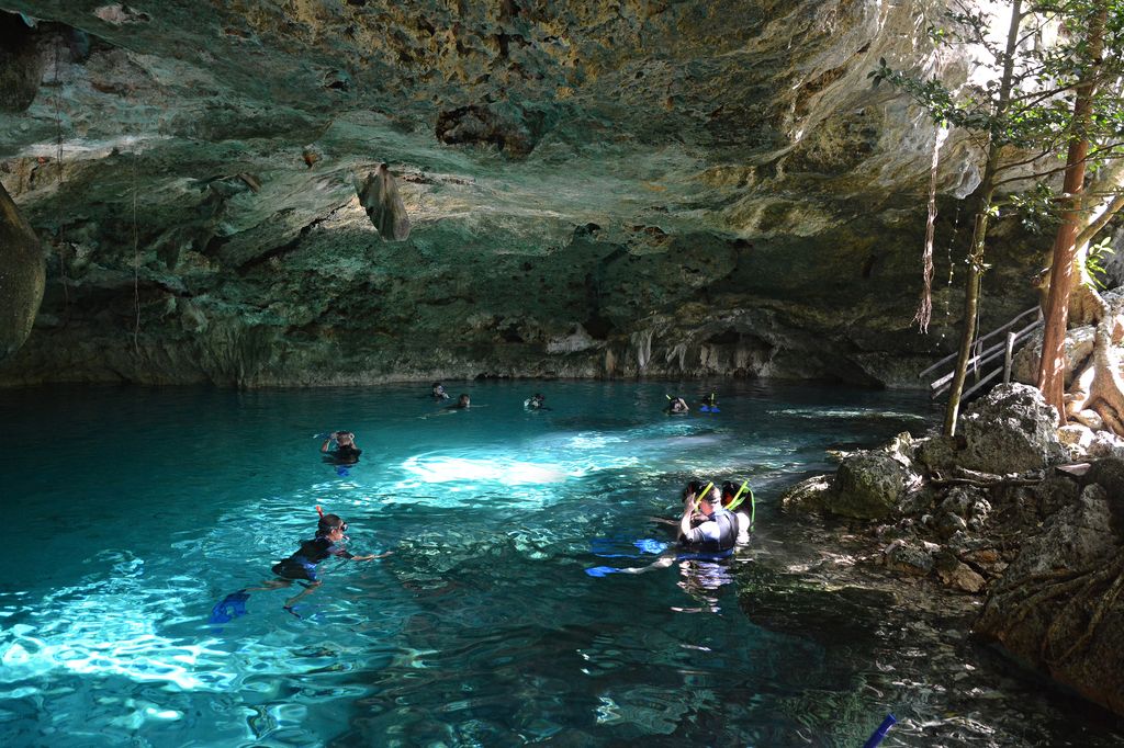 People swimming at Cenote Dos Ojos in Mexico