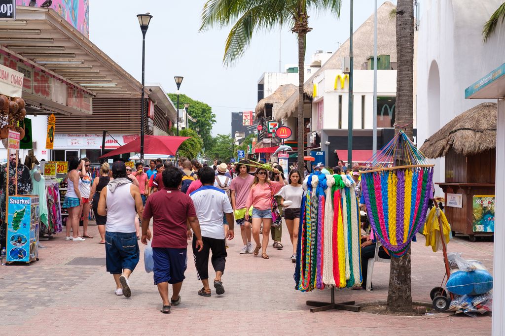 People walking on a busy street in Playa del Carmen, Mexico