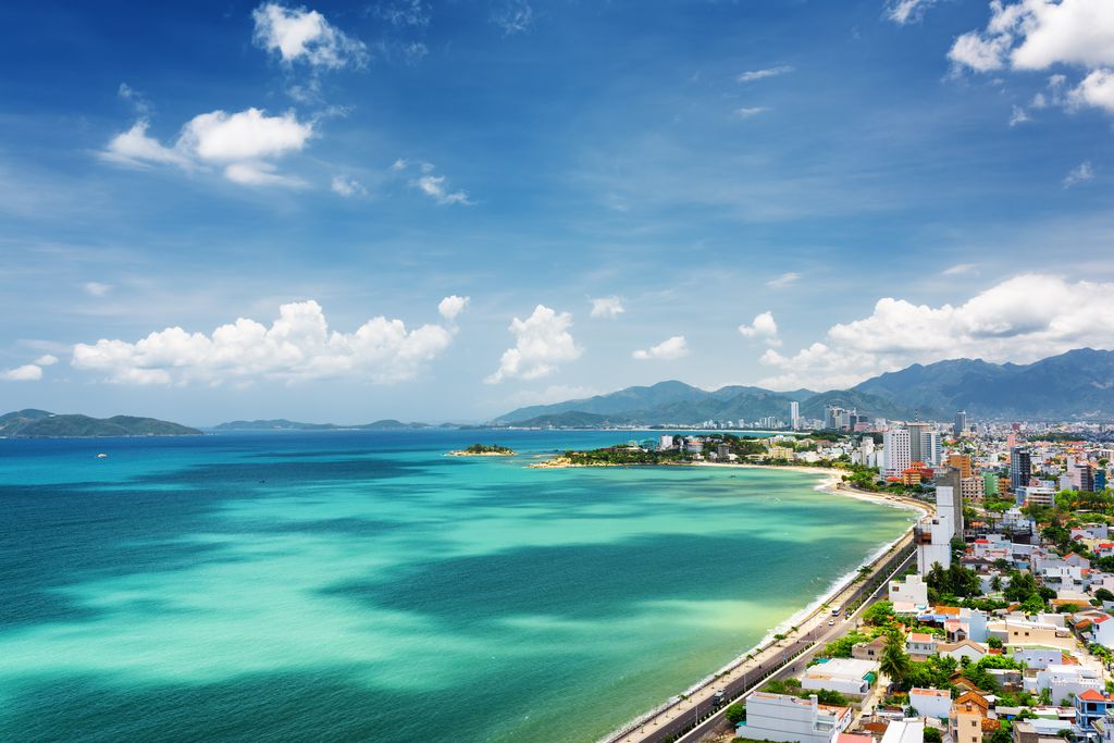 A beautiful beach with blue waters and coastal city in Nha Trang, Vietnam