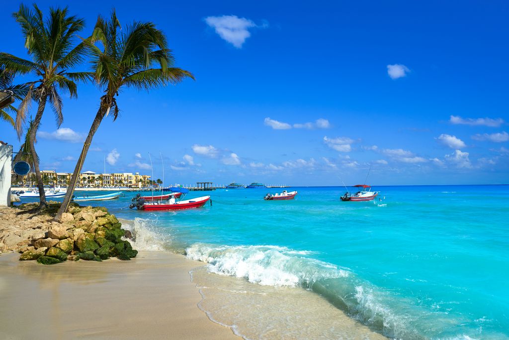 Playa del Carmen beach with blue waters, a destination for backpacking the Yucatan