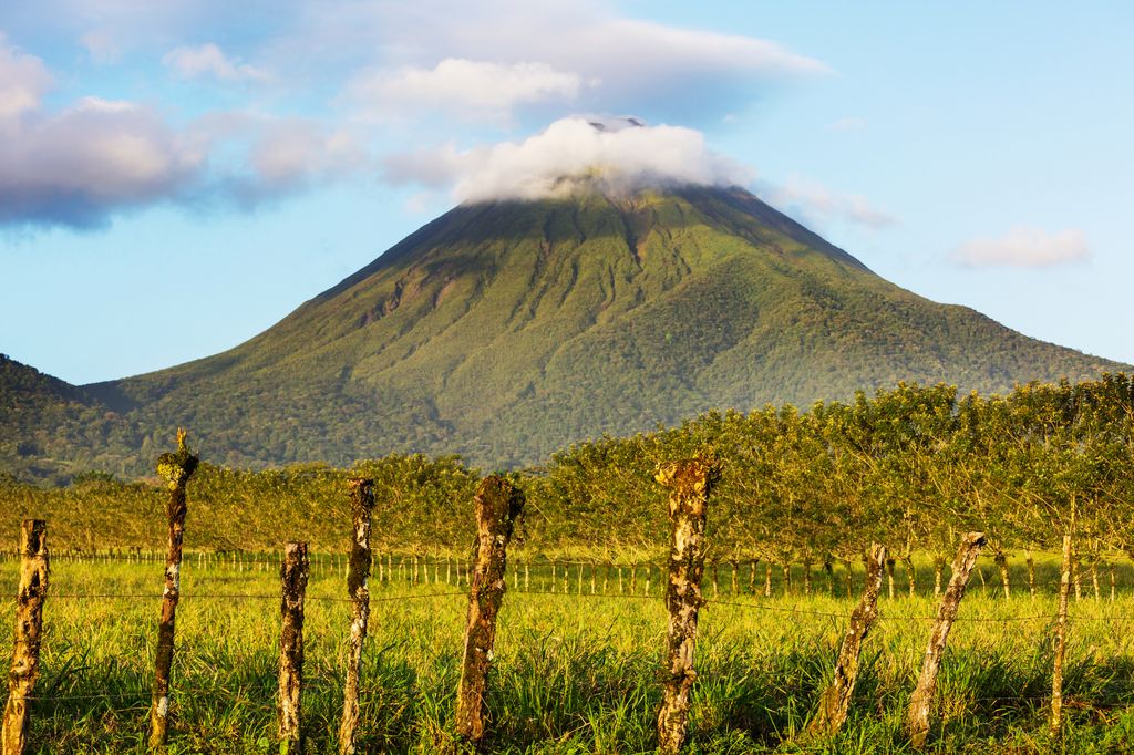 The Arenal Volcano with clouds covering its top in Costa Rica