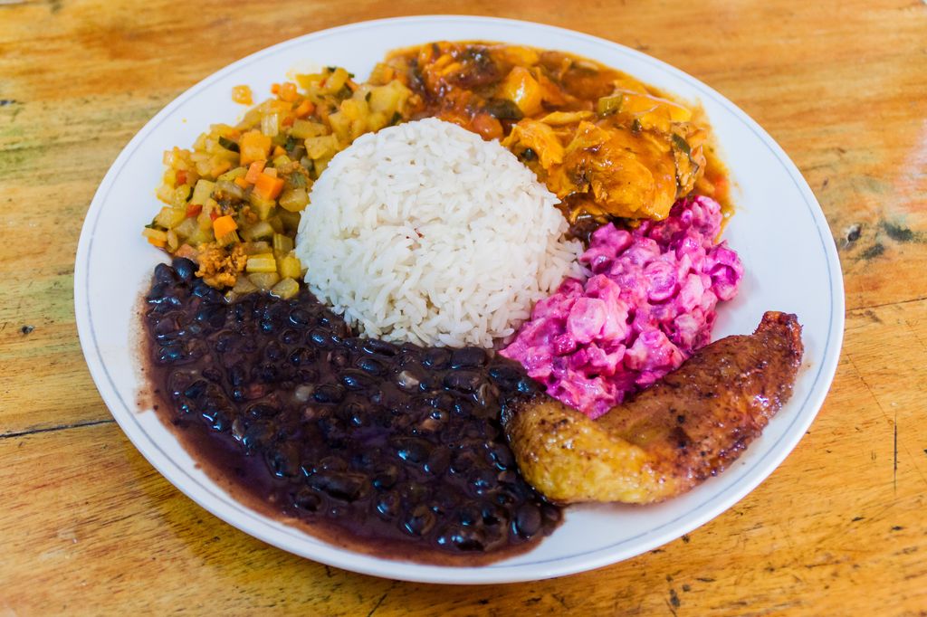 Casado, a Costa Rican meal plate with rice, black beans, veggies, and other food
