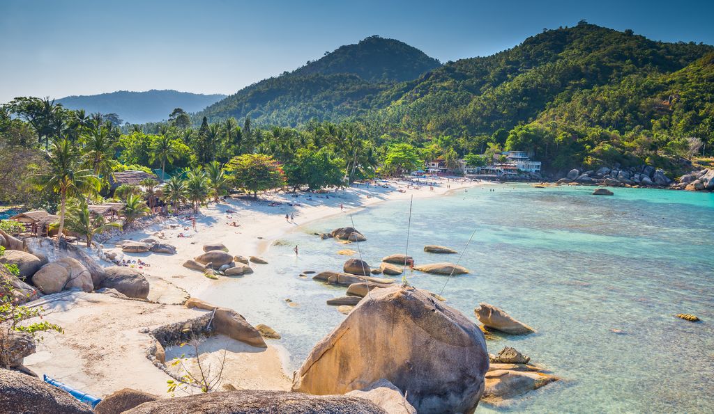 Crystal Beach in Thailand surrounded by trees and big rocks