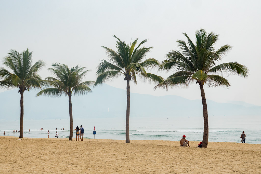 My Khe Beach with people and palm trees