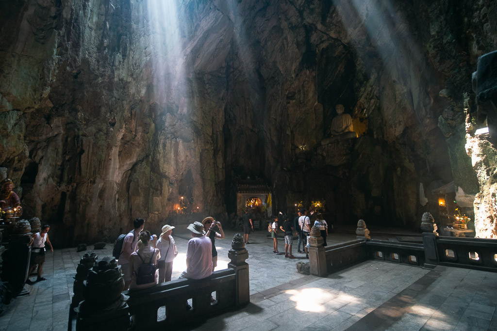 The inside of the Marble Mountain in Vietnam with tourists
