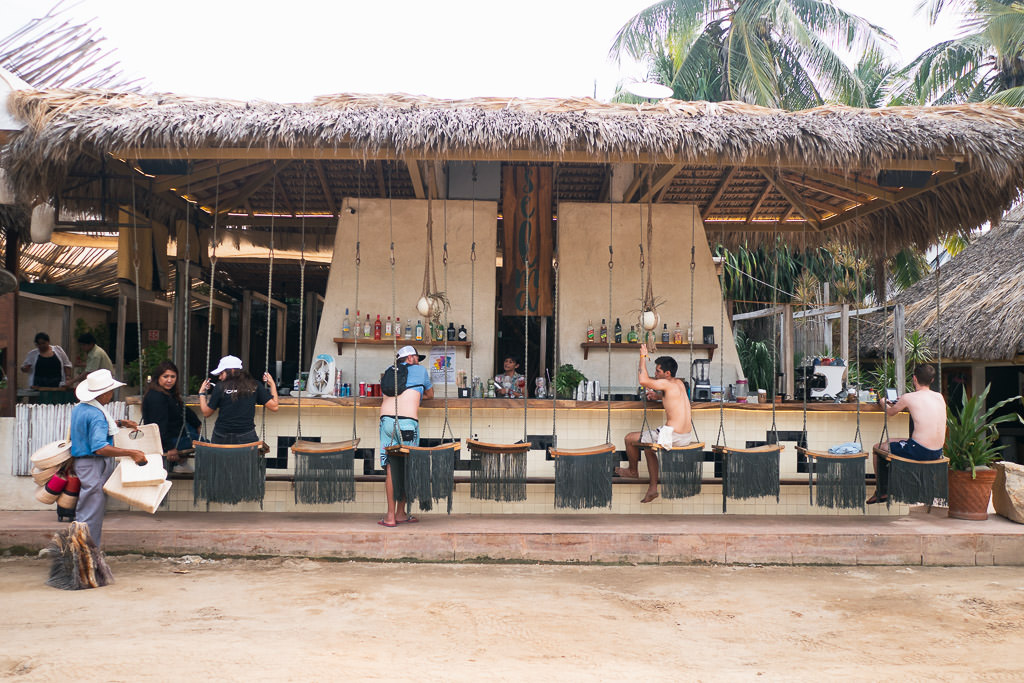 Bar at La Punta beach with chairs and swings.