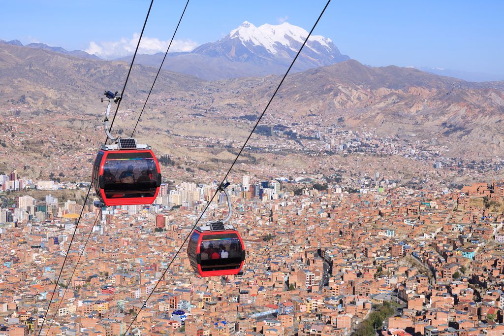 Two cable cars above the city in La Paz, Bolivia