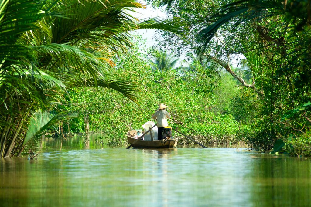 A man on a boat on Mekong Delta, Vietnam