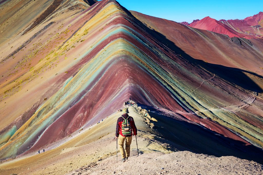 A person hiking the Rainbow Mountain in Peru
