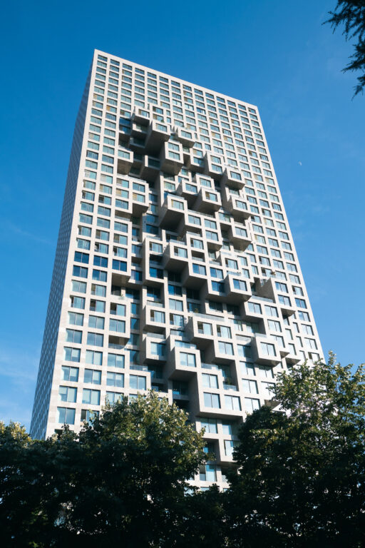 Modern high-rise building with geometric balconies in Tirana