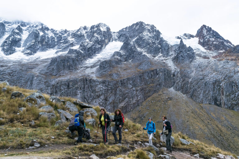 hikers trekking in the mountains within Huascaran National Park, Cordillera Blanca, Peru