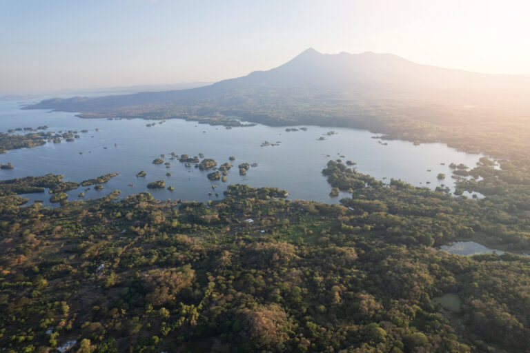 Aerial view of the Islets of Granada scattered across Lake Nicaragua beneath a Mombacho Volcano