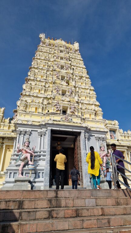 Gopuram of Arulmigu Balathandayuthapani Hill Temple, Penang, with worshippers on the steps