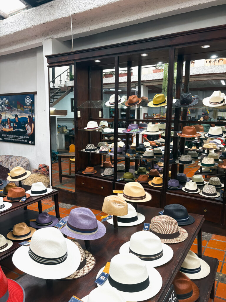 An array of colorful, handcrafted Panama hats on display at the Panama Hat Museum in Cuenca