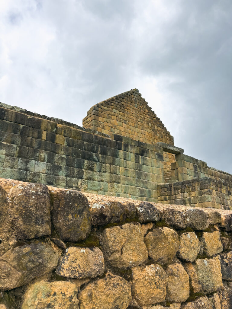 low-angle shot of the Incan stone walls and the Sun Temple at Ingapirca